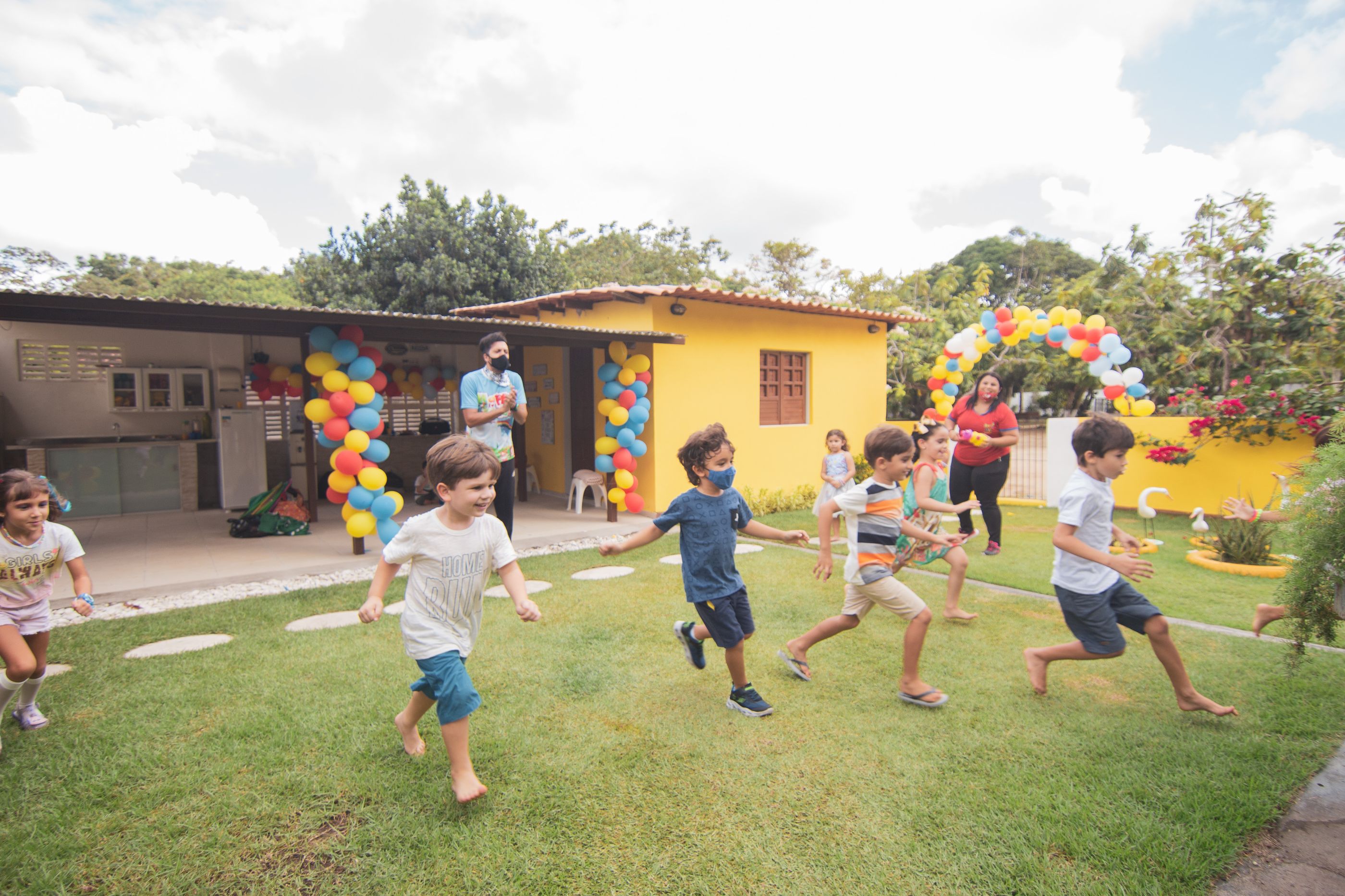 Children running and playing at an outdoor party